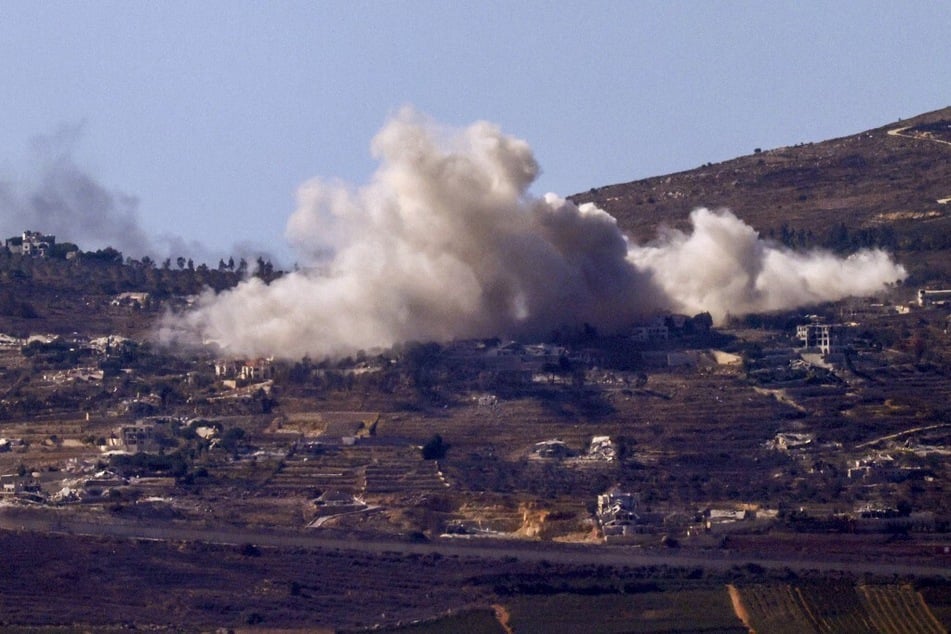 Smoke billows above the Lebanese village of Odaisseh during Israeli bombardment on October 19, 2024.