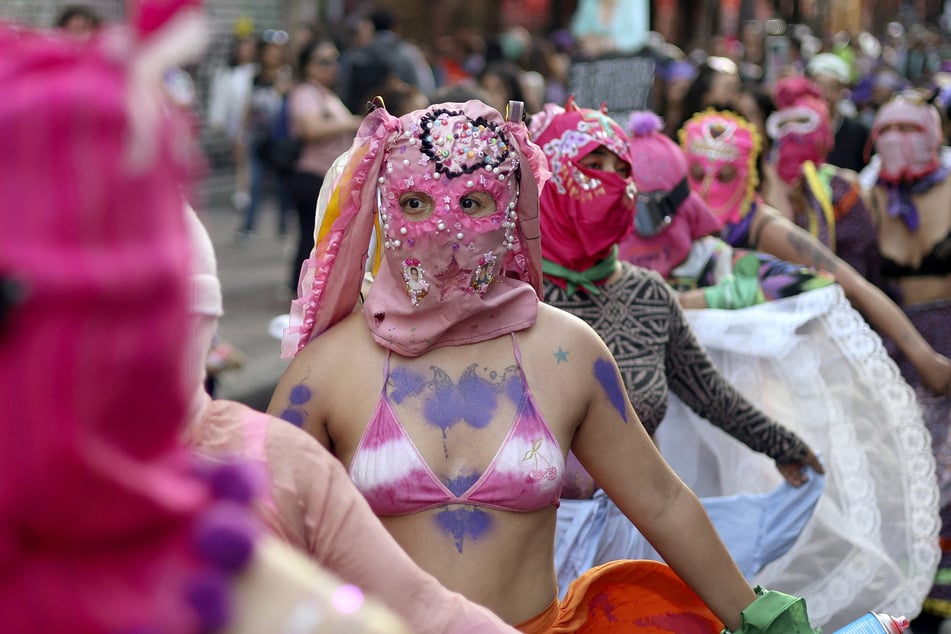 Women dance during a rally for the International Women's Day in Mexico City on Saturday.