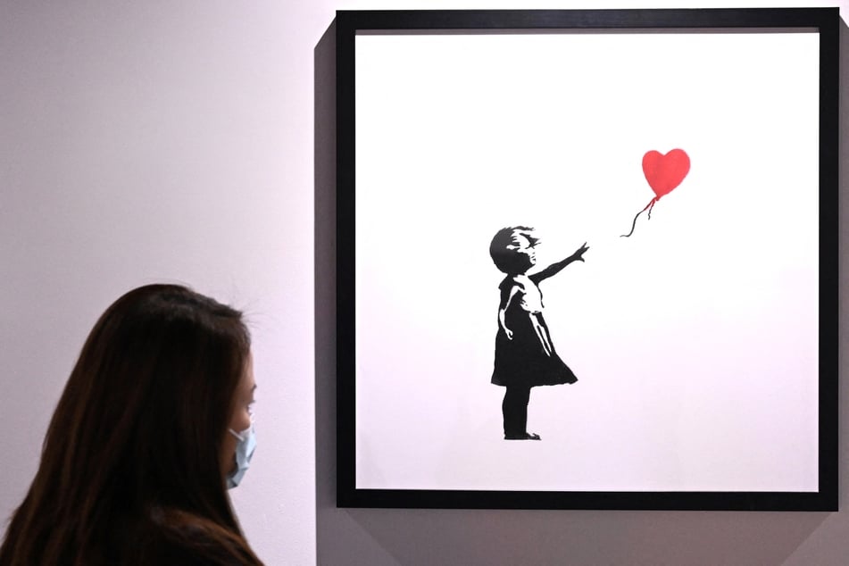 Eins der berühmtesten Gemälde des Künstlers "Banksy": "Love is in the Bin".