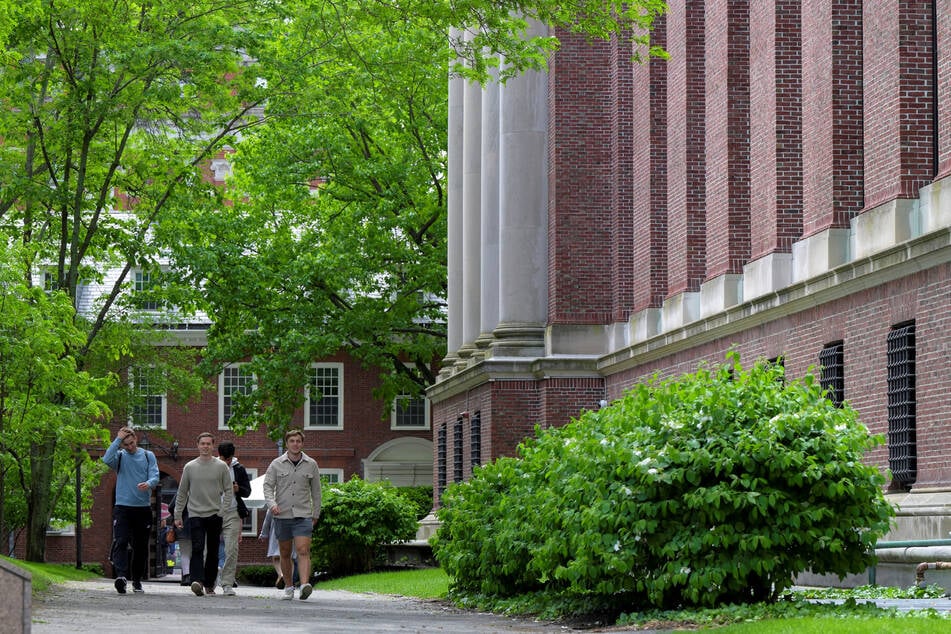 Students walk on the campus of Harvard University in Cambridge, Massachusetts, on May 23, 2025.