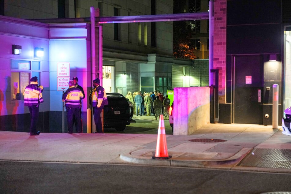 National Guard soldiers gather outside the Office of the Chief Medical Examiner, where the body of soldier Sarah Beckstrom was transported in Washington DC on Thursday.