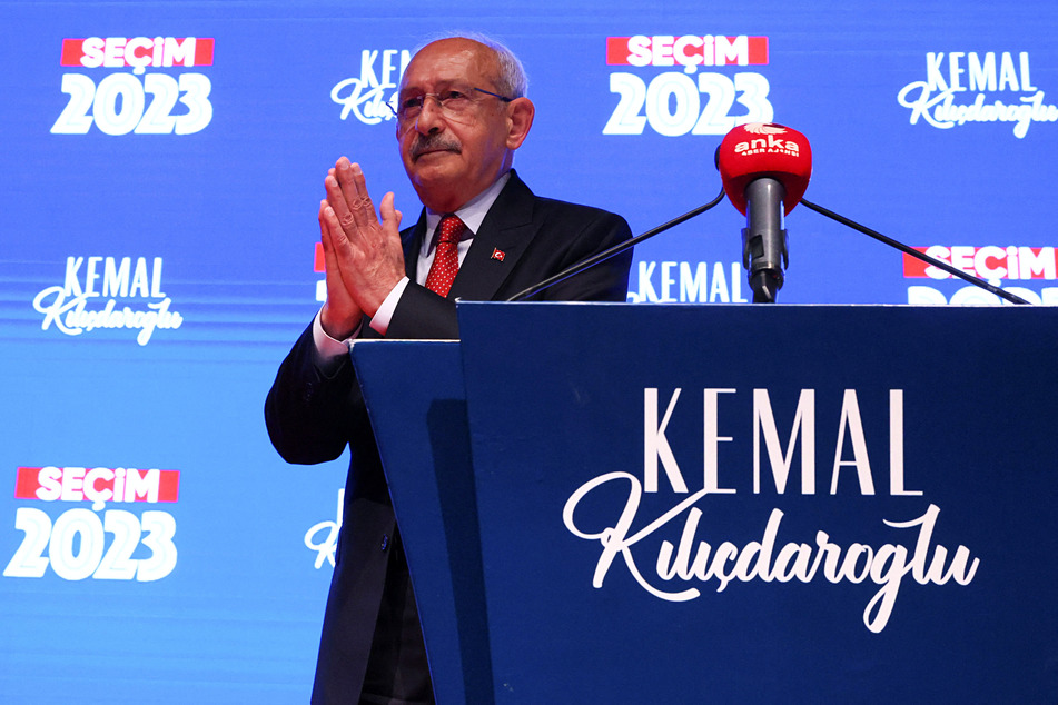 Kemal Kilicdaroglu, presidential candidate of Turkey's main opposition alliance, gestures after speaking following early exit poll results for the second round of the presidential election.