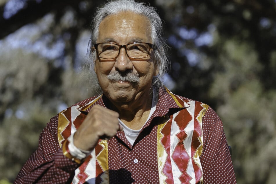 Indigenous freedom fighter Leonard Peltier raises his fist after his release from prison after receiving executive clemency from outgoing President Joe Biden.