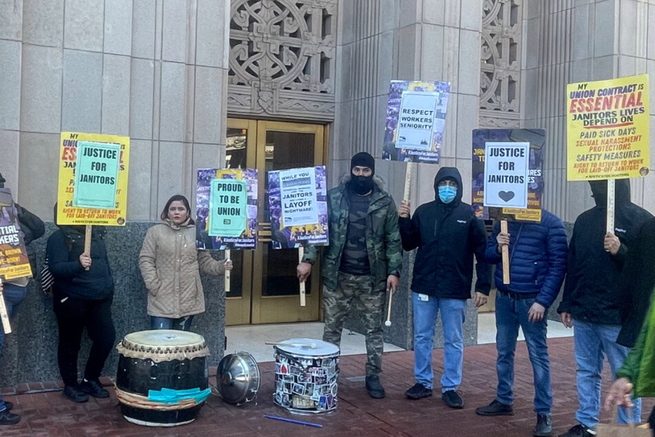 Janitors picketing in front of Twitter's headquarters in San Francisco on Monday.