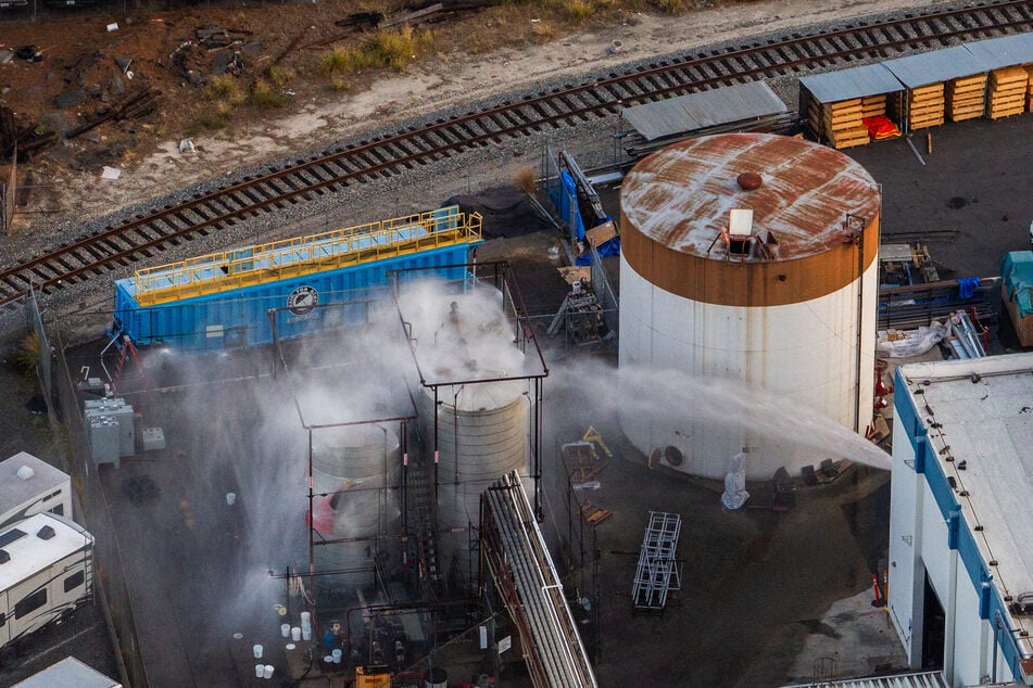 An aerial view of water being sprayed onto an overheated 34,000-gallon tank at GKN Aerospace in Garden Grove, California, on May 23, 2026.