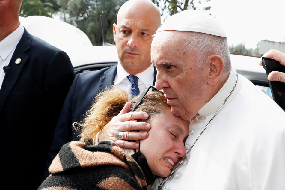 Pope Francis comforted a grieving mother after he was released from hospital, having spent almost three days there being treated for bronchitis.