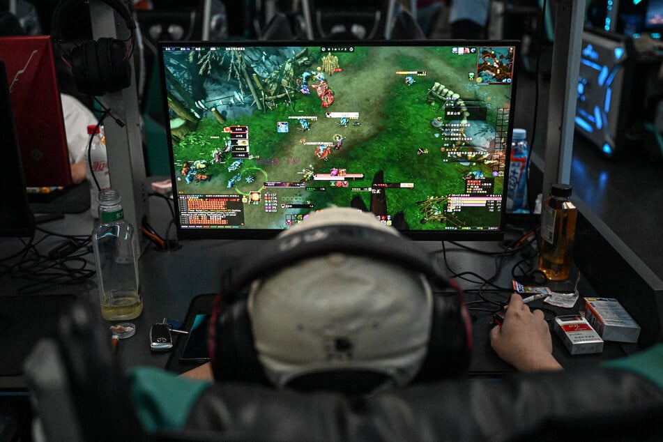 A man plays the online game World of Warcraft at an internet cafe in Beijing after US gaming giant Blizzard relaunched its game in China on August 1, 2024.