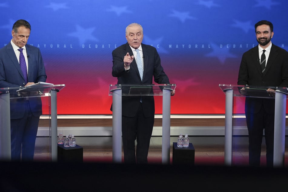 (From l. to r.) New York City mayoral candidates Independent Andrew Cuomo, Republican Curtis Sliwa, and Democratic Zohran Mamdani debate in New York on October 16, 2025.