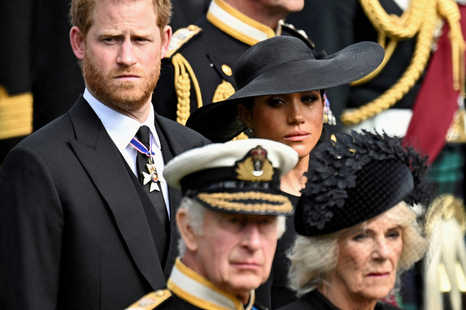 Prince Harry (l.) will attend his father King Charles III’s coronation, but Meghan Markle will miss the historic occasion.
