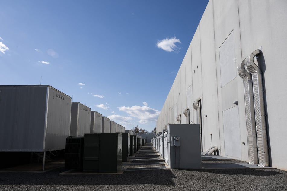 Substations, transformers and backup generators are seen at a Digital Realty data center in Ashburn, Virginia on November 12, 2025.