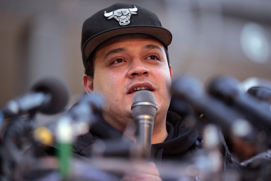 Kilmar Abrego Garcia speaks to supporters as he arrives for his first check-in at the US Immigration and Customs Enforcement Baltimore Field Office on December 12, 2025, the day after a federal judge ordered his release from a detention facility in Pennsylvania.
