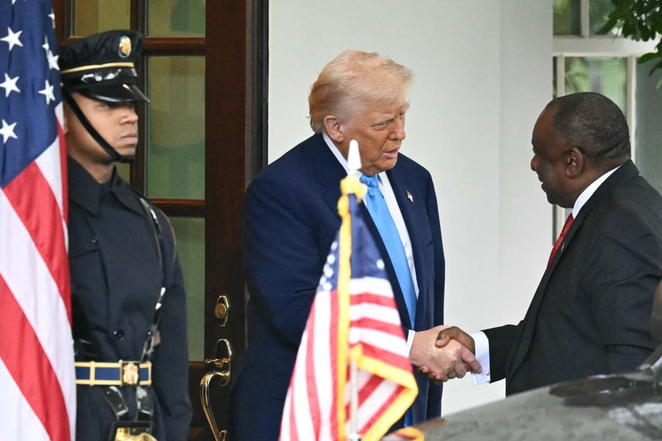 Donald Trump's (c.) administration has torn into a series of policies in South Africa since the US president began his second term in office.