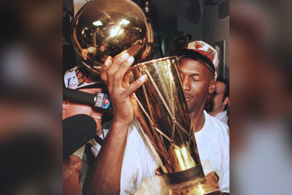 Michael Jordan celebrates his NBA championship win on Father's Day in 1996.