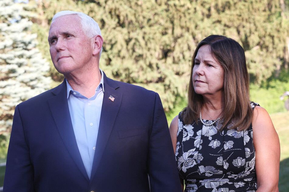 Mike Pence stands with his wife Karen Pence as he speaks to press after a campaign event in Neola, Iowa on July 06, 2023.