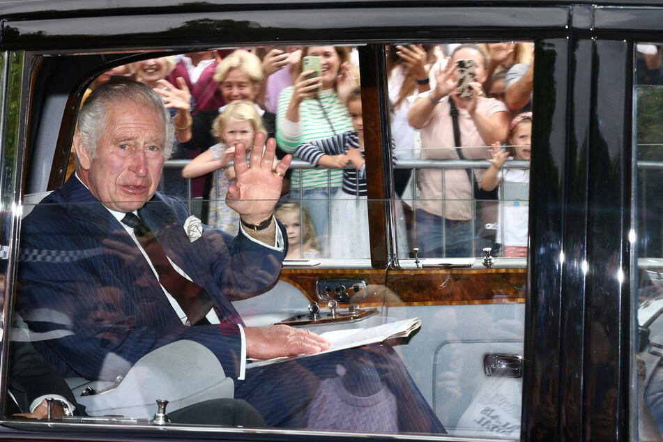 King Charles arrives at Buckingham Palace after the Accession Council ceremony during which he was proclaimed the UK's new monarch.