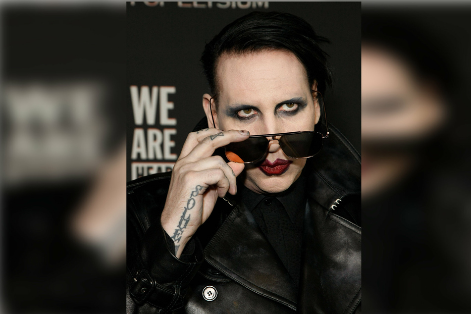Rocker Marilyn Manson (52) has turned himself in to authorities following allegations of assault at a 2019 gig.