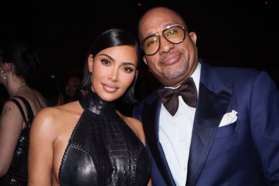 Kim Kardashian posed with director Kenya Barris (r.) at the fourth annual Fifteen Percent Gala.