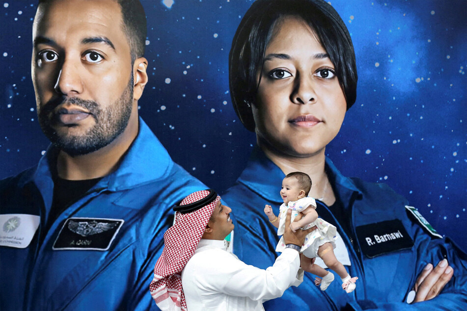 A Saudi man and his daughter ahead of the launch of the SpaceX flight carrying two Saudi nationals, Rayyanah Barnawi (r.) and Ali Al-Qarni (l.), to the International Space Station.