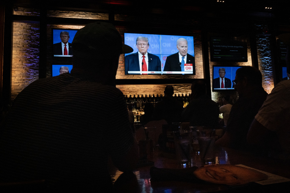 Guests at the Old Town Pour House watch the debate between President Joe Biden and presumptive Republican nominee former President Donald Trump on Thursday in Chicago, Illinois. The debate is the first of two scheduled between the two candidates before the November election.