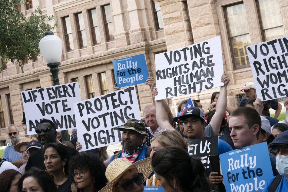 Protestors gather at the Texas State Capitol to denounce voter suppression bills that were stalled in the state legislature.