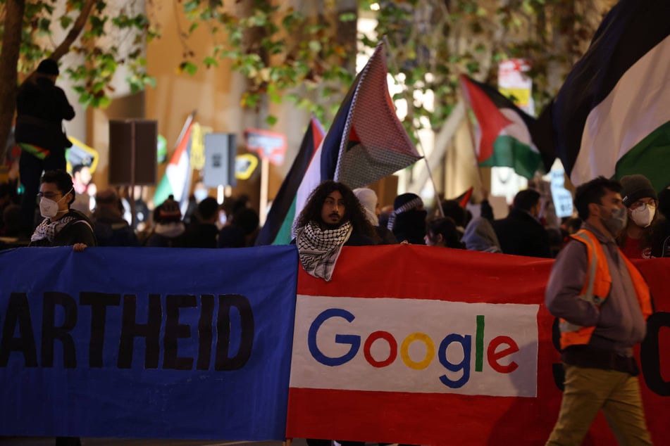 Palestine solidarity protesters call on Google to end its Project Nimbus as they block Market Street in San Francisco, California.