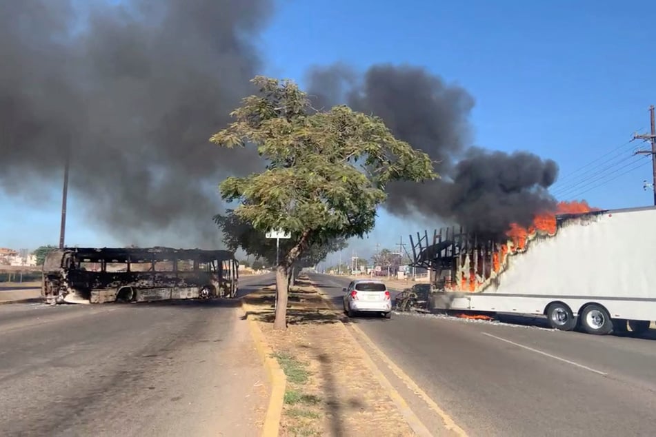 Members of the Sinaloa cartel burned vehicles and stormed an airport over the arrest of Ovidio Guzmán, El Chapo's son.