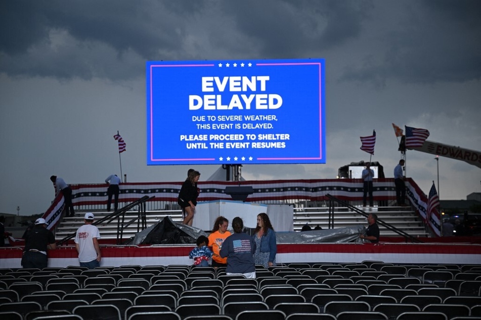 Workers dismantle the stage where Donald Trump was to speak at a campaign rally in Wilmington, North Carolina, on April 20, 2024.