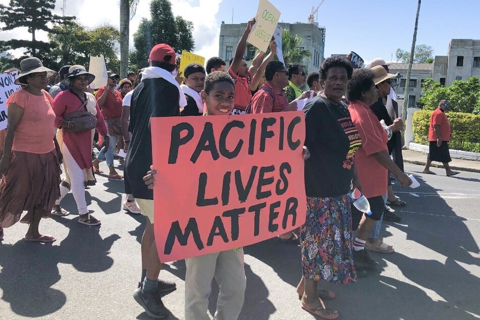 Protestors march against Japan's release of wastewater from the Fukushima nuclear plant into the Pacific Ocean on the streets of Fiji's capital of Suva on August 25, 2023.