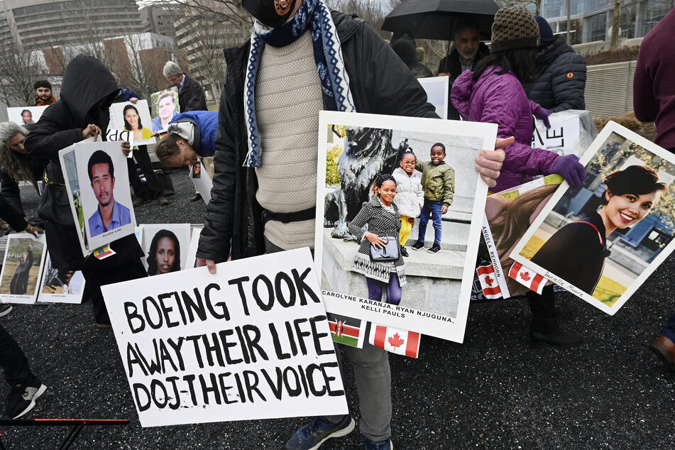 Families and friends who lost loved ones in the March 10, 2019, Boeing 737 Max crash in Ethiopia, hold a memorial protest in front of the Boeing headquarters in Arlington, Virginia, on March 10, 2023 to mark the four-year anniversary of the event.