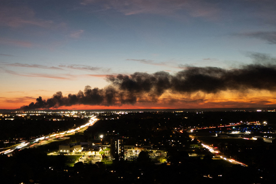 Smoke is seen billowing across the sky after a UPS cargo plane crash near the Louisville International Airport in Kentucky on November 4, 2025.