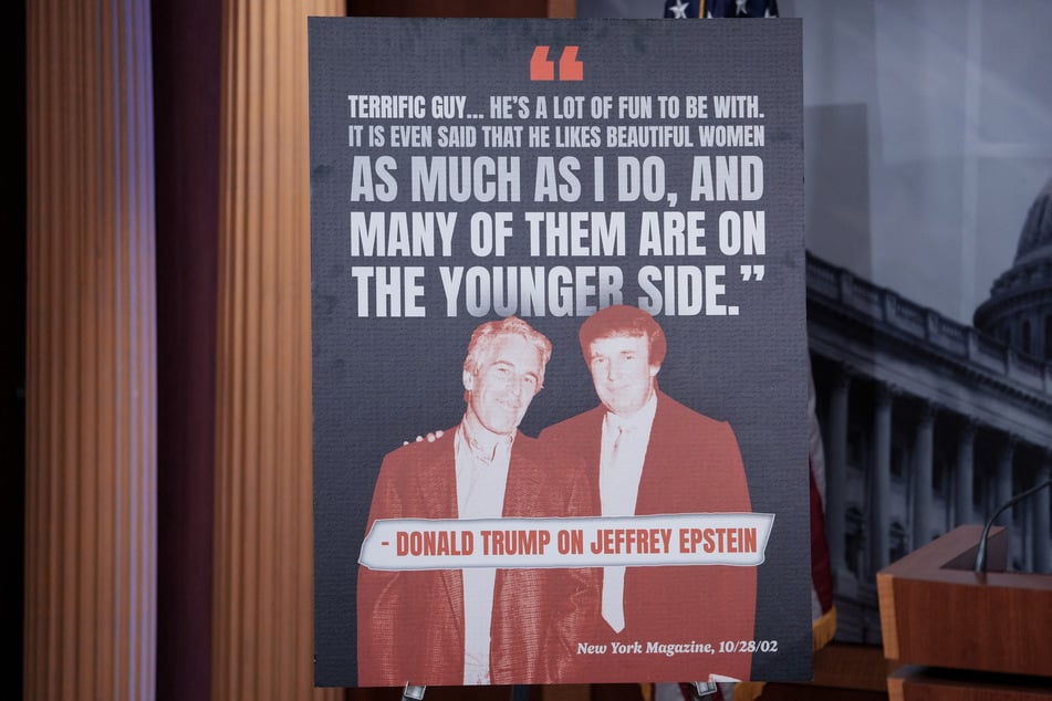 A sign showing a photo of President Donald Trump and Jeffrey Epstein is displayed ahead of a news conference at the US Capitol in Washington, DC, on July 30, 2025.