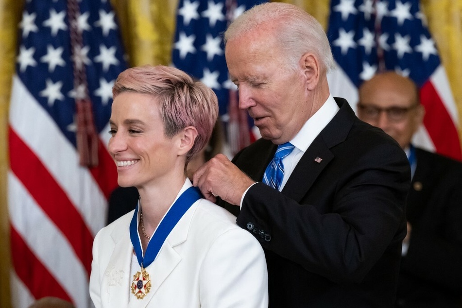 US President Joe Biden presents US soccer player Megan Rapinoe with the Presidential Medal of Freedom, the nation's highest civilian honor.