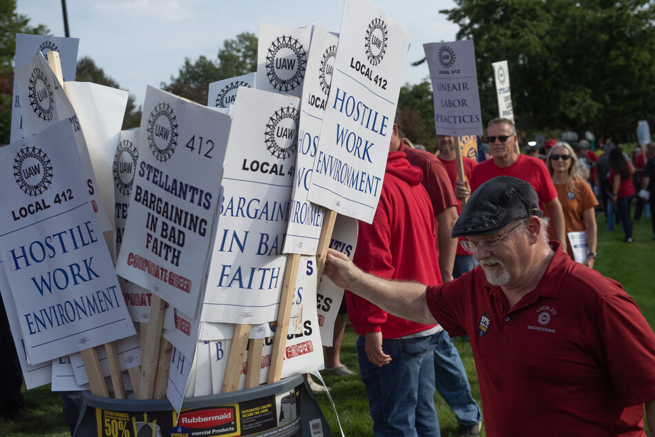 Stellantis and UAW reach tentative agreement, while GM workers stage new walkout