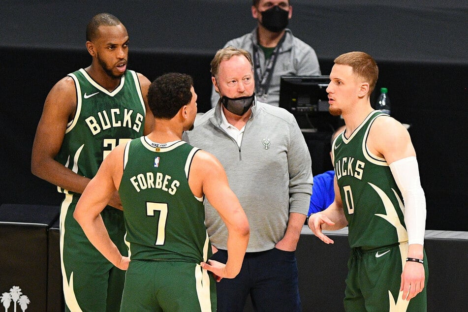 Mike Budenholzer (c.) led the Milwaukee Bucks to their first NBA title in 50 years.