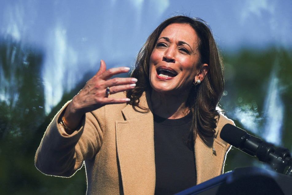 Kamala Harris speaks behind protective glass during a campaign stop in North Hampton, New Hampshire, on September 4, 2024.