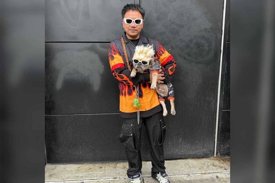 Player the dog and his human are taking the flavortown by storm in their matching Guy Fieri outfits.