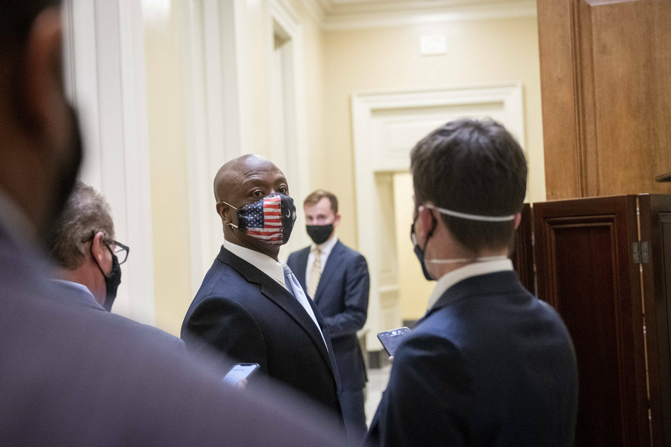 Tim Scott speaks with reporters at the Capitol after giving his Republican response speech.