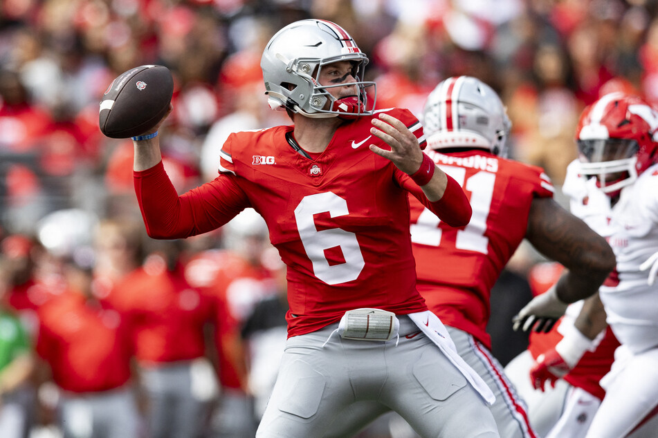 Ohio State QB Kyle McCord impressed with 14 of 20 passes for 258 yards and three touchdowns.