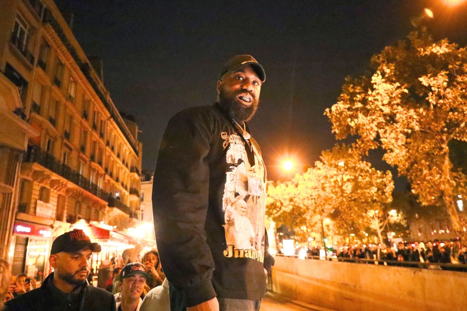 Rapper Kanye West defended his antisemitic views in a recent interview, and claimed the success of his new album proves he can never be canceled.