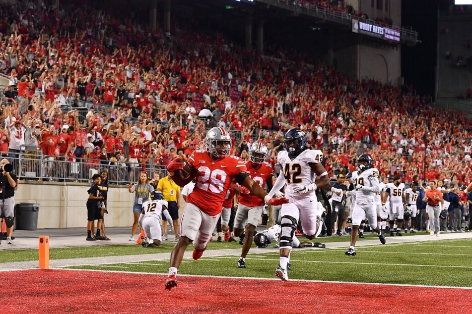 TC Caffey of the Ohio State Buckeyes scores a touchdown during the fourth quarter of a game against the Toledo Rockets.