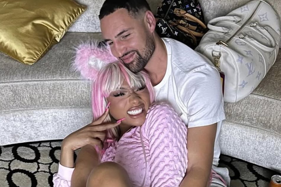 Klay Thompson (r.) dispelled gossip that he split from Megan Thee Stallion (l.) with his latest Instagram dump.