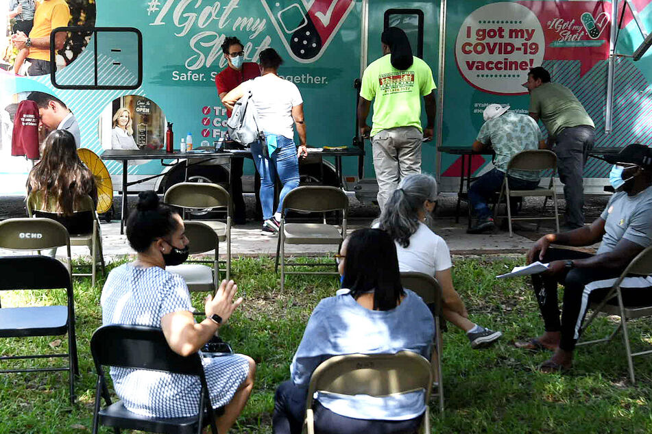 People getting the shot at a mobile vaccination center in Orlando, Florida.