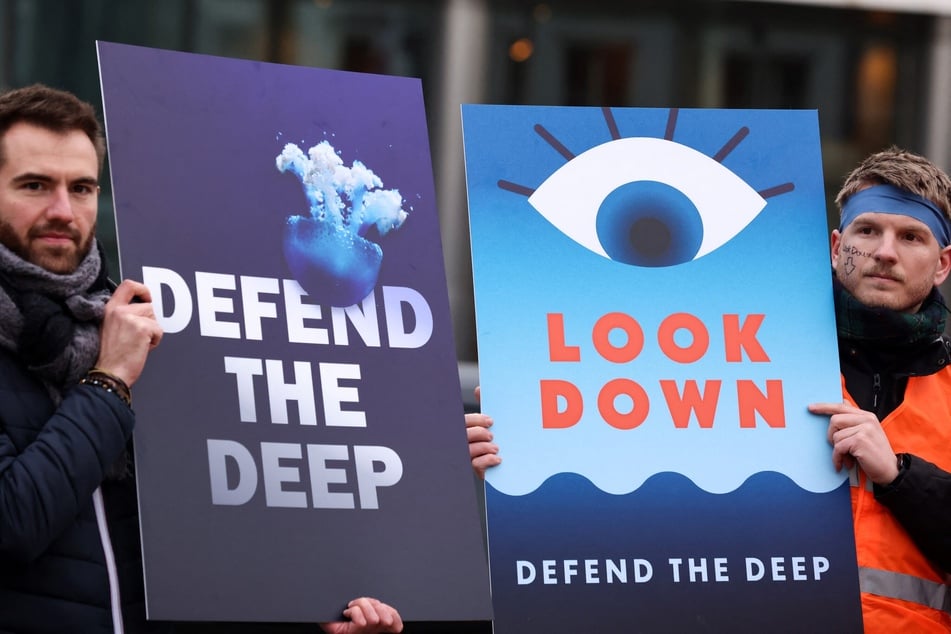 Activists take part at a "Look Down" rally to stop deep-sea mining outside the European Parliament in Brussels, Belgium.