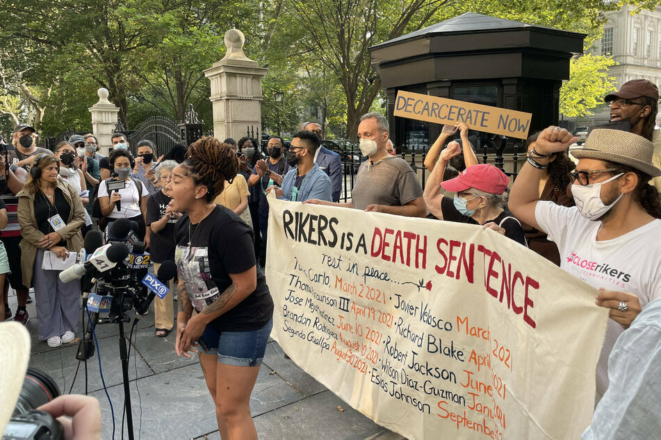 Protesters gather outside New York City Hall on September 15 demanding the decarceration of Rikers Island.