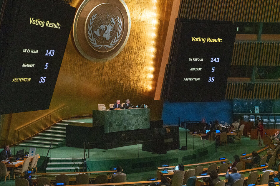 The final vote on the resolution to condemn Russia's annexation of Ukrainian regions displayed on screens at United Nations General Assembly hall in New York.