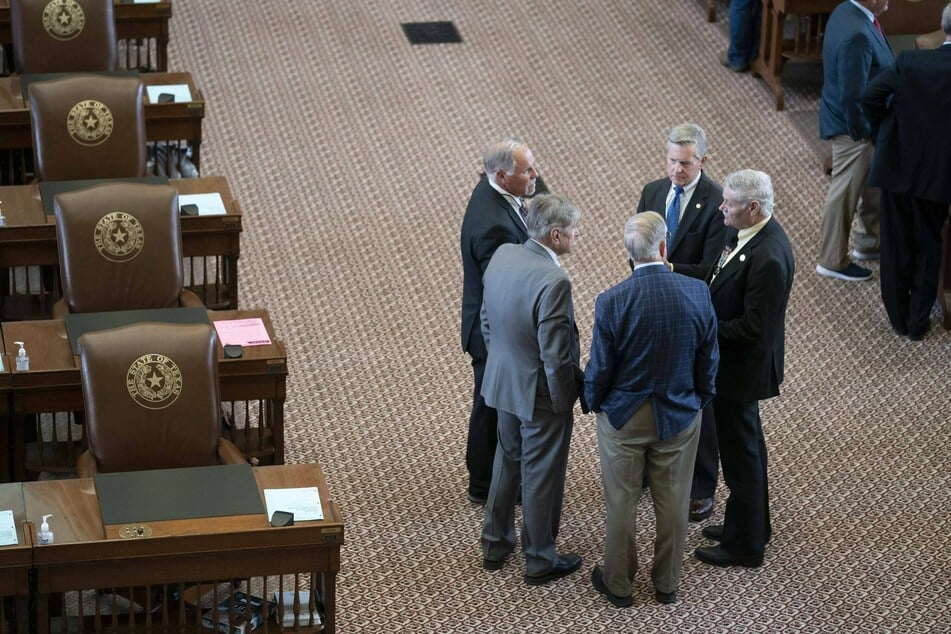 Texas House Republicans chat amongst themselves on the second day of failing to get a quorum at a special session on July 14, 2021.