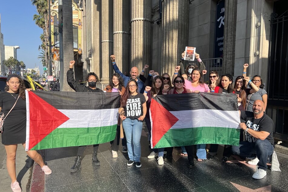 Peace activists rally for Palestinian freedom outside the Jimmy Kimmel Live studio during Vice President Kamala Harris' interview.