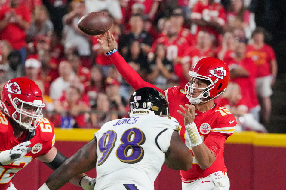 Kansas City Chiefs quarterback Patrick Mahomes throws a pass as Baltimore Ravens defensive tackle Travis Jones defends during the first half.