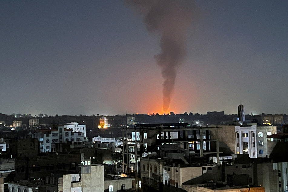 Smoke rises in the sky following US-led airstrikes in Sanaa, Yemen, on February 25, 2024.