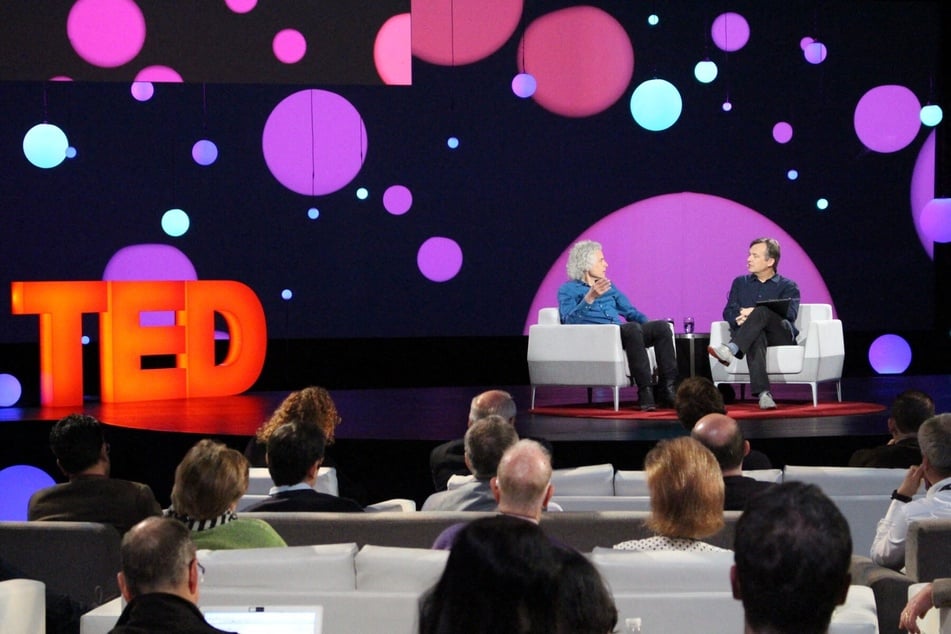 Author and cognitive science professor Steven Pinker (l.) speaks with TED Conference curator Chris Anderson (r.) on whether optimists or pessimists are right about where the world is heading, April 12, 2018 during the TED Conference in Vancouver, Canada.